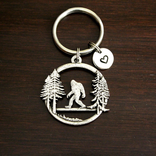 Sasquatch with pine trees large round keychain
