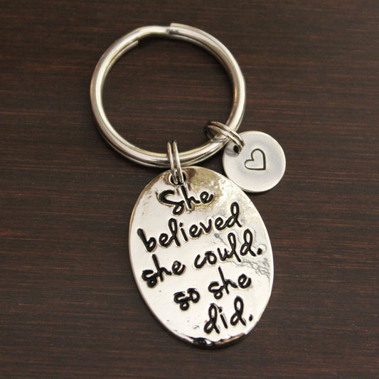 She believed she could. so she did. oval keychain