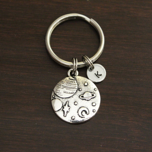 Space keychain with raised planets, moon and stars