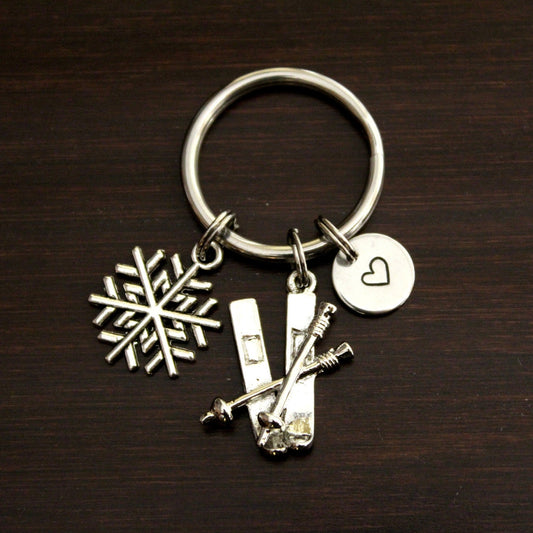 Keychain with skis, poles and snowflake charms